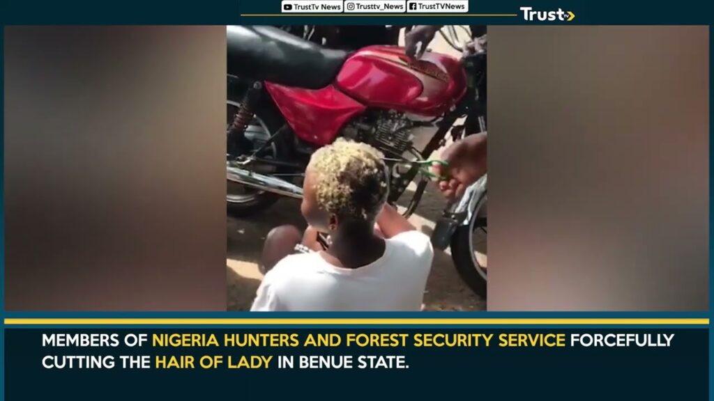 Nigeria Hunters And Forest Security Service Forcefully Cutting The Hair Of Lady In Benue State